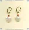 White heart shaped freshwater pearl earrings with faceted ruby gemstone accent on gold fill leverback earwires. - Click for a larger picture