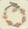 Faceted heart-shaped strawberry quartz, freshwater pearls and sterling silver bracelet. - Click for a larger picture