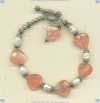 Faceted heart-shaped strawberry quartz, freshwater pearls and sterling silver bracelet. - Click for a larger picture