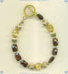 Handmade toggle bracelet faceted chiclet garnet and faceted citrine rondel gemstones and 14k/gold fill beads. - Click for a larger picture
