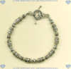 Sterling silver bracelet with handmade beads and toggle clasp. - Click for a larger picture