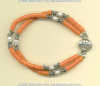 Natural coral heishi, and freshwater pearl double strand bracelet with handmade silver beads. - Click for a larger picture