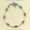 Freshwater pearl, artisan crafted sterling silver, and peridot gemstone bead bracelet with toggle clasp. - Click for a larger picture