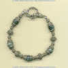 Cat's eye gemstone bracelet with handmade sterling silver beads and toggle. - Click for a larger picture