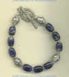 Handmade sodalite gemstone bracelet with handmade sterling silver beads and toggle. - Click for a larger picture