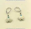 Fossil coral Zuni bear sterling silver leverback earrings with turquoise heishi and black onyx gemstone accents.
- Click for a larger picture