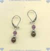 Hand made sterling silver leverback earrings with garnet and amethyst gemstones. - Click for a larger picture
