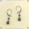 Hand made sterling silver leverback earrings with garnet and amethyst gemstones. - Click for a larger picture