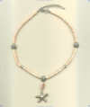 Hill Tribe silver starfish pendant on pink shell heishi necklace. - Click for a larger picture