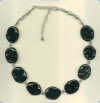 Irregular Disk Shaped Obsidian Semiprecious Gemstone and Handmade Sterling Silver Bead Necklace. - Click for a larger picture