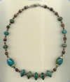 Necklace with Peruvian turquoise and red tiger eye semi precious gemstone, and hand made sterling silver beads. - Click for a larger picture