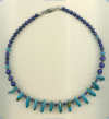 Necklace with turquoise gemstones, lapis lazuli, and hand made sterling silver beads. - Click for a larger picture