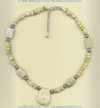 Fossilized coral and shell necklace with handmade sterling silver accents. - Click for a larger picture