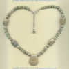 Fossilized coral and shell necklace with handmade sterling silver accents. - Click for a larger picture