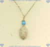 Handcrafted fossilized coral and turquoise gemstone pendant with 14K gold fill accent beads. - Click for a larger picture