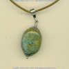 Peruvian turquoise pendant with handmade sterling silver findings.				
 - Click for a larger picture