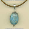 Peruvian turquoise pendant with handmade sterling silver findings.				
 - Click for a larger picture