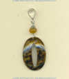 Carved cowrie shell and carnelian gemstone pendant with handmade sterling silver findings.			
 - Click for a larger picture