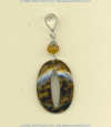 Carved cowrie shell and carnelian gemstone pendant with handmade sterling silver findings.			
 - Click for a larger picture