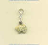Fossil coral Zuni bear split bail pendant with handmade sterling silver coil bead accent.				
 - Click for a larger picture