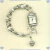 Double strand sterling silver bracelet watch with toggle closure and celestial charm accent. - Click for a larger picture
