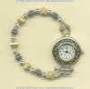 Handmade two-tone Japanese quartz movement watch with 14K gold fill and handmade sterling silver beads and toggle clasp. - Click for a larger picture