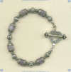 Bracelet with 8 mm lavender chalcedony semi-precious gemstones and hand made sterling silver beads and toggle. - Click for a larger picture