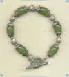 Bracelet with olive quartz and handmade sterling silver beads and toggle. - Click for a larger picture
