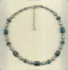 Spiderweb blue turquoise and handmade sterling silver bead necklace. - Click for a larger picture