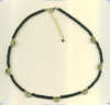 Handmade necklace with black onyx tubes and handmade vermeil half moon beads with extender chain. - Click for a larger picture