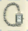 Sterling silver and stainless steel watch with oblong face and mixed sterling silver beads. - Click for a larger picture